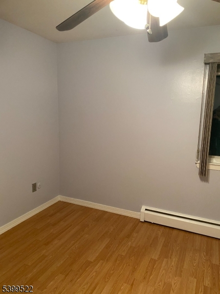 180 Littleton Road East, Unit 20 Parsippany, NJ 07054 - Photo 3 of 5 a view of a room with wooden floor and small window