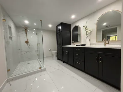 a bathroom with a bathtub and a shower