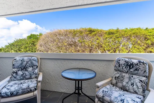 a view of balcony with chairs