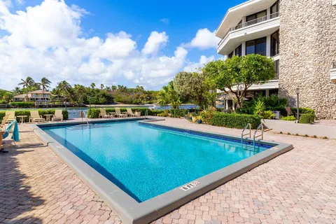 an aerial view of house with yard swimming pool and outdoor seating