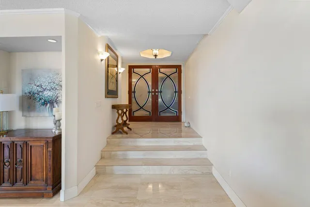 a kitchen that has a lot of cabinets in it and appliances