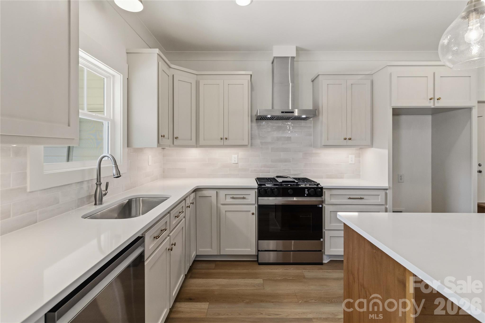 352 Adams Road Clover, SC 29710 - Photo 10 of 38 a kitchen with cabinets appliances a sink and a counter top space