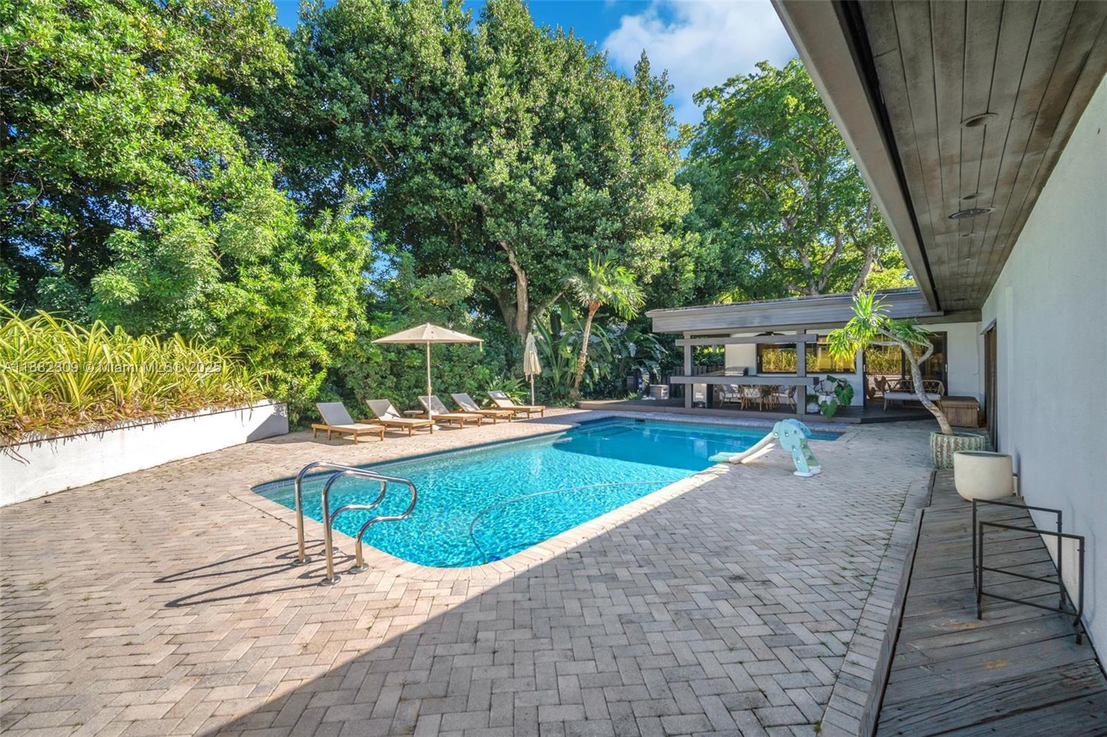 4401 Sanders Street Hollywood, FL 33021 - Photo 14 of 71 a view of a swimming pool with a patio