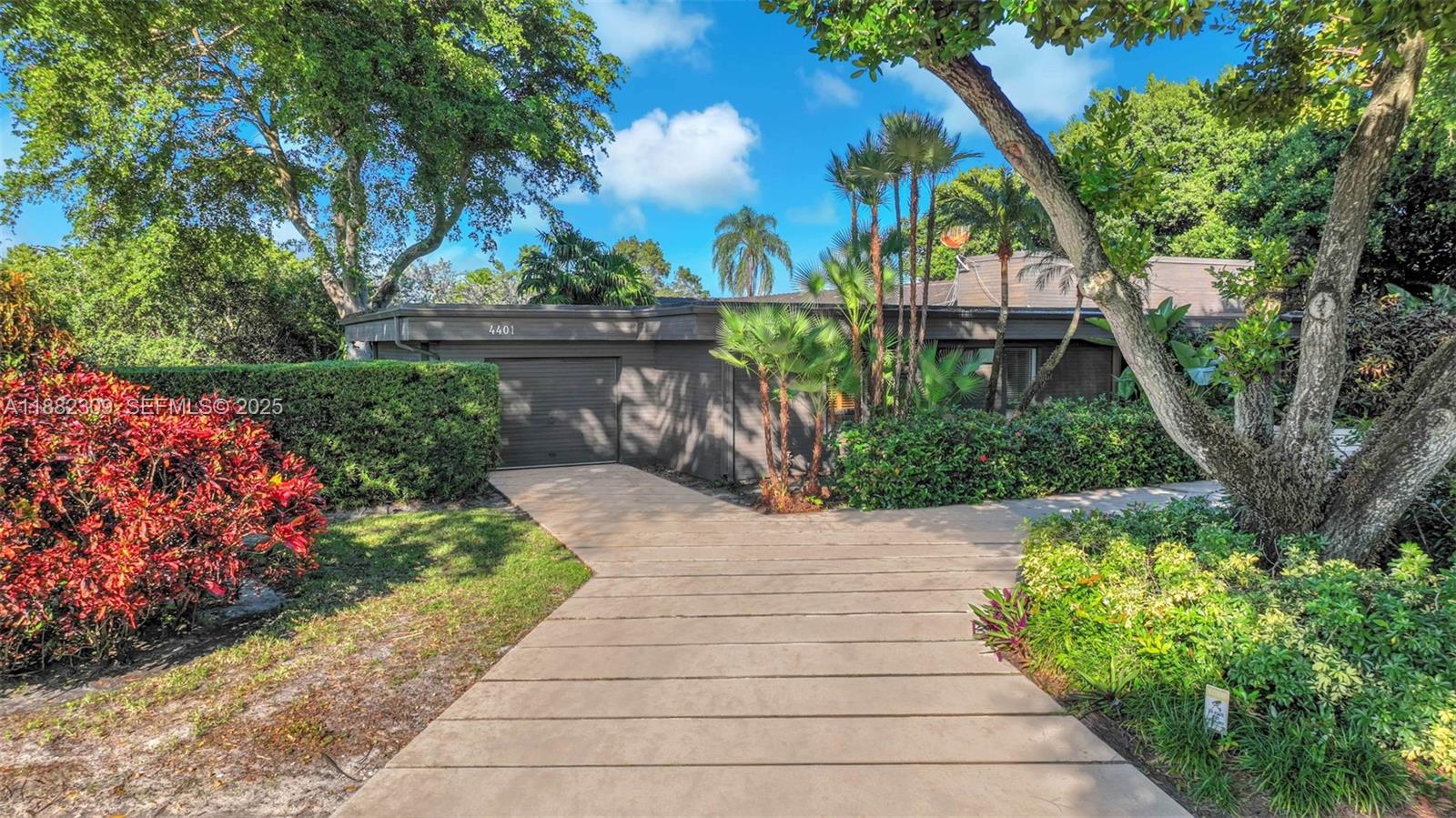 4401 Sanders Street Hollywood, FL 33021 - Photo 19 of 71 a view of a garden with pathway