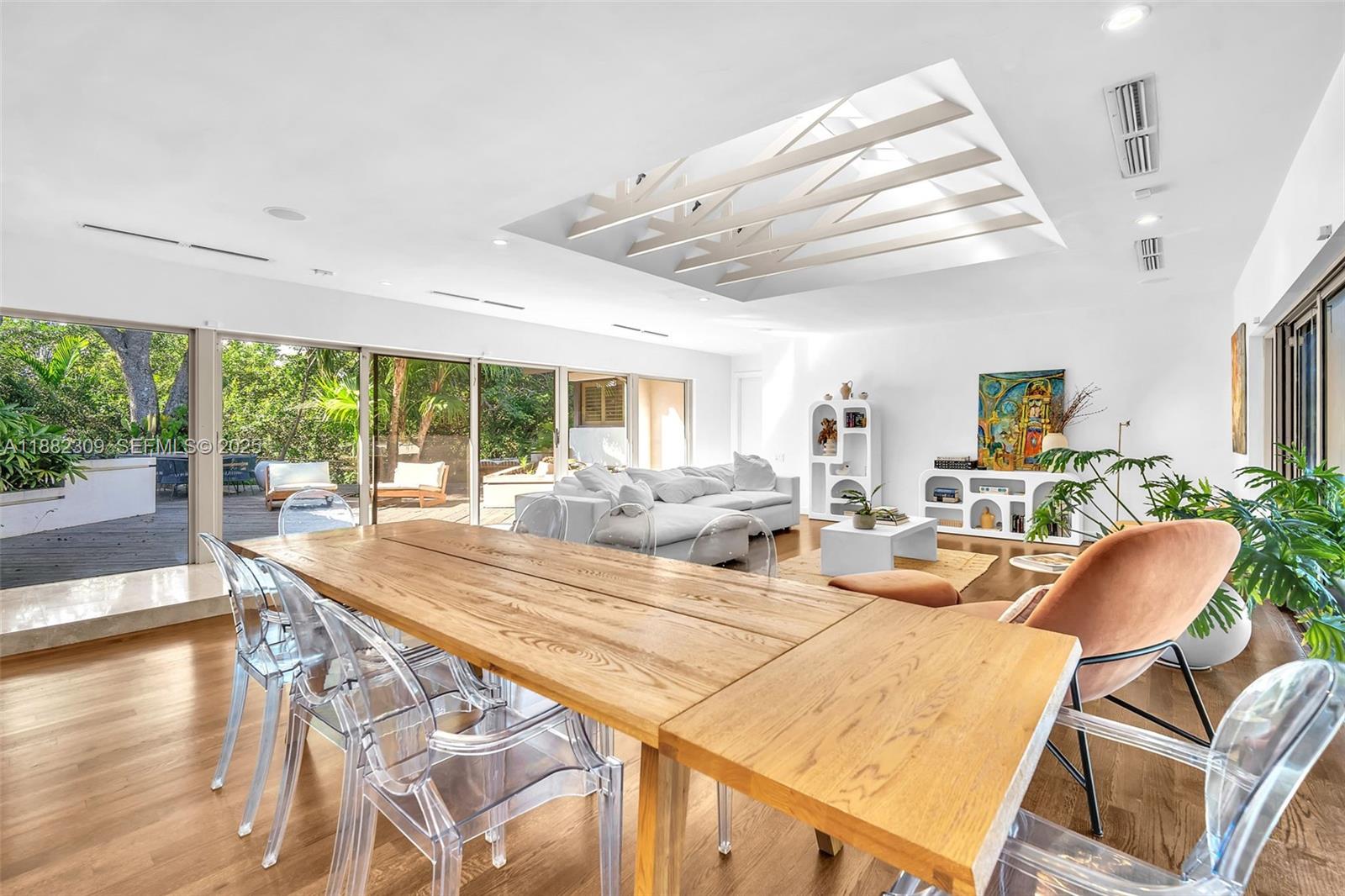 4401 Sanders Street Hollywood, FL 33021 - Photo 2 of 71 a view of a dining room with furniture wooden floor and chandelier