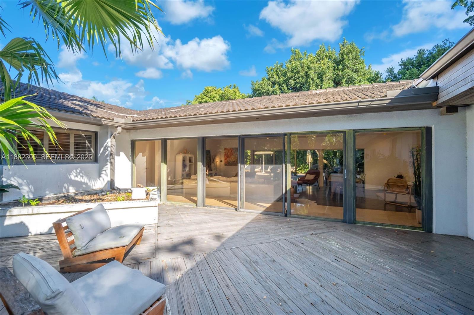 4401 Sanders Street Hollywood, FL 33021 - Photo 22 of 71 a chair and table in front of a building