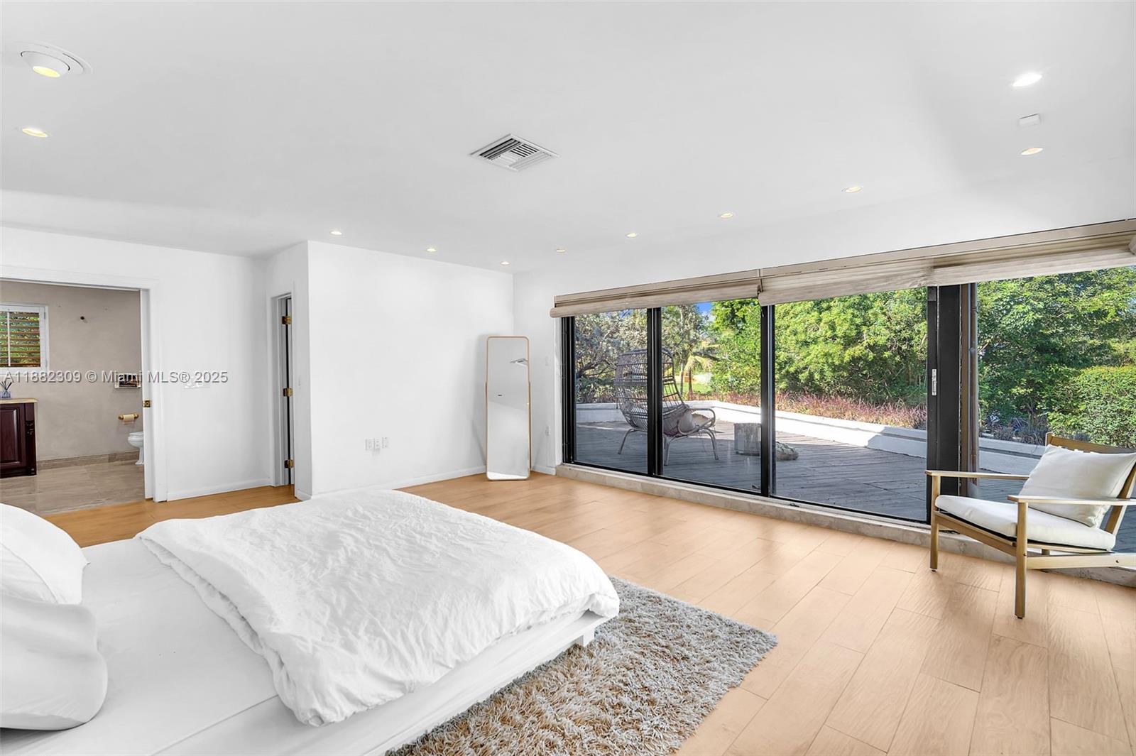 4401 Sanders Street Hollywood, FL 33021 - Photo 57 of 71 a bedroom with a large bed and a large window