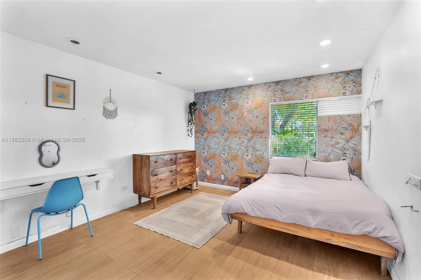 4401 Sanders Street Hollywood, FL 33021 - Photo 6 of 71 a bedroom with a bed a chair and a large window