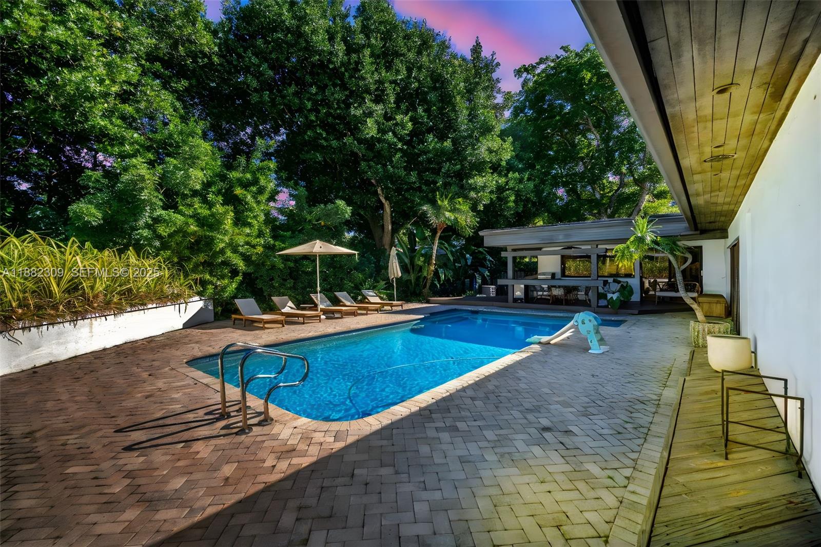 4401 Sanders Street Hollywood, FL 33021 - Photo 66 of 71 a view of a swimming pool with a patio