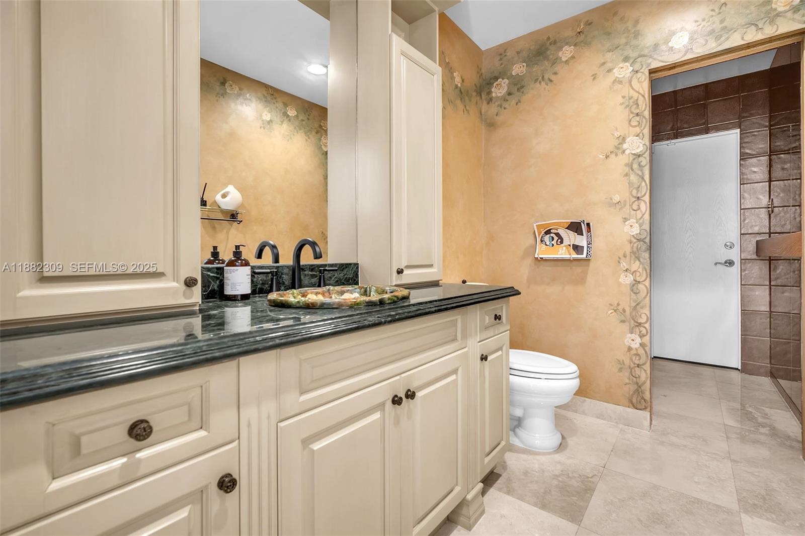 4401 Sanders Street Hollywood, FL 33021 - Photo 68 of 71 a bathroom with a granite countertop sink a toilet a mirror and shower