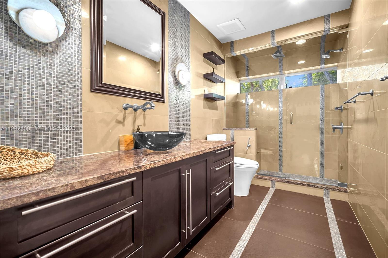 4401 Sanders Street Hollywood, FL 33021 - Photo 8 of 71 a bathroom with a granite countertop sink mirror and toilet