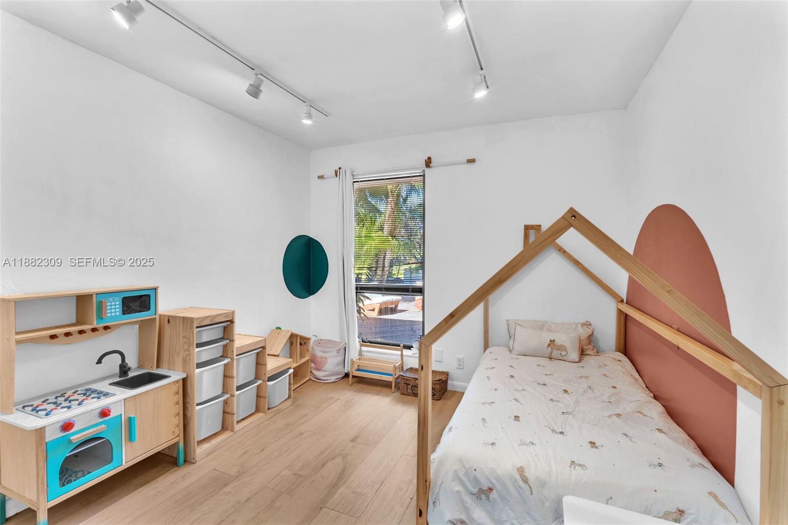 4401 Sanders Street Hollywood, FL 33021 - Photo 9 of 71 a bedroom with furniture and a wooden floor