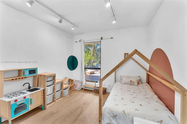 a bedroom with double bed and a window