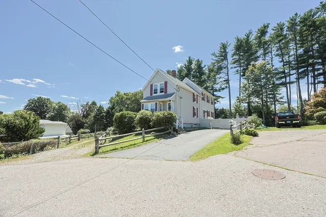 a view of a house with basketball court