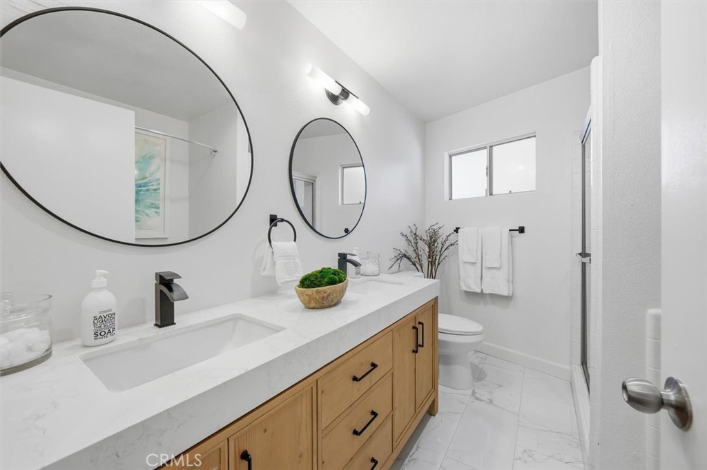 222 7th Street, Unit 202 Santa Monica, CA 90402 - Photo 29 of 41 a bathroom with a sink and a mirror