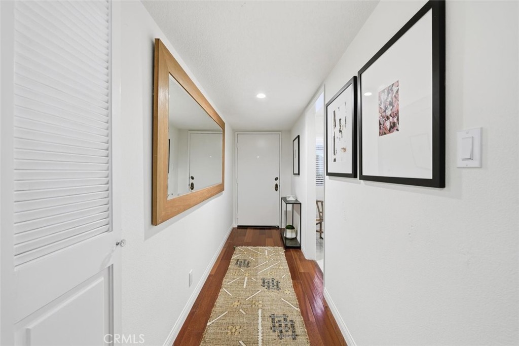 222 7th Street, Unit 202 Santa Monica, CA 90402 - Photo 3 of 41 a hallway with wooden floor and entryway