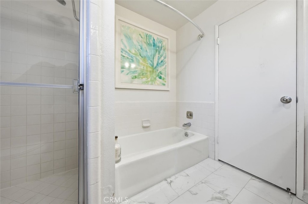 222 7th Street, Unit 202 Santa Monica, CA 90402 - Photo 31 of 41 a white bath tub sitting next to a window