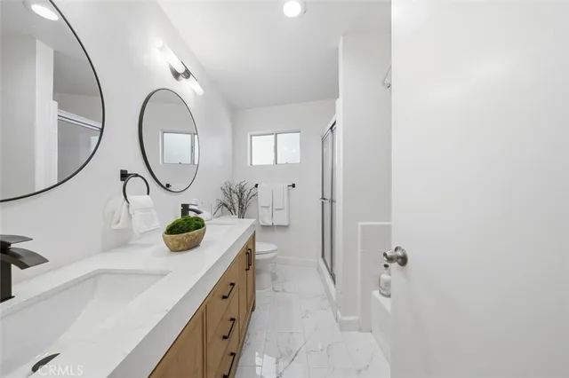 a bathroom with a sink vanity and a mirror