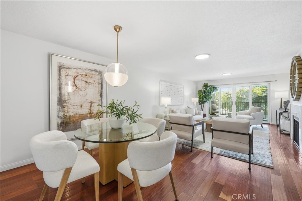 222 7th Street, Unit 202 Santa Monica, CA 90402 - Photo 5 of 41 a dining room with furniture a chandelier and wooden floor