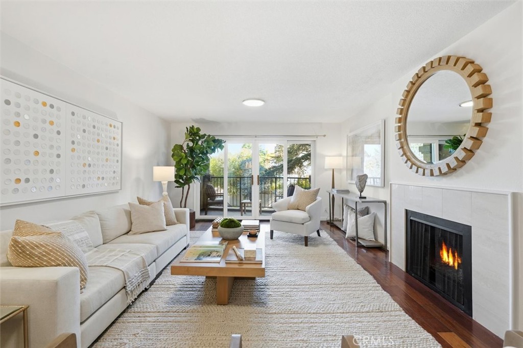 222 7th Street, Unit 202 Santa Monica, CA 90402 - Photo 6 of 41 a living room with furniture and a fireplace