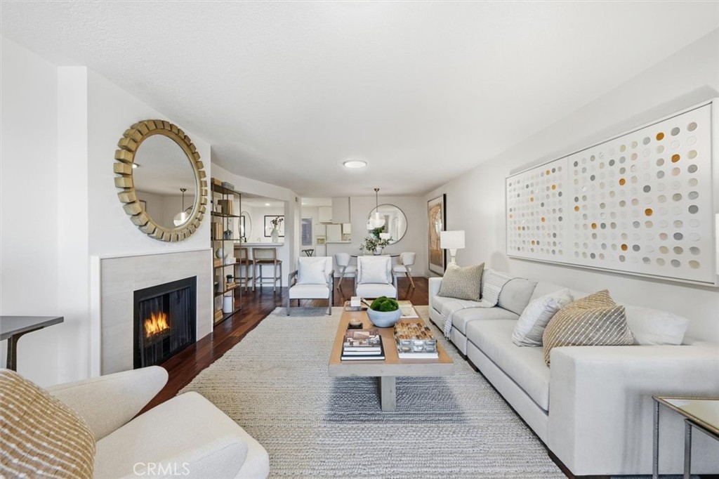 222 7th Street, Unit 202 Santa Monica, CA 90402 - Photo 10 of 41 a living room with furniture and a fireplace