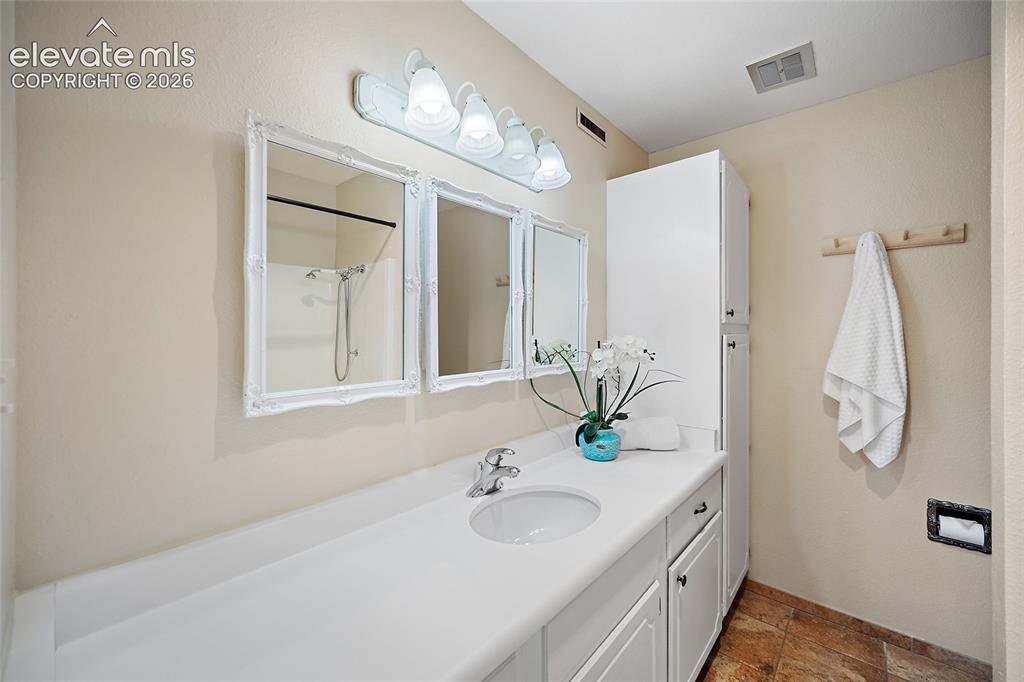 2979 Mesa Road, Unit D Colorado Springs, CO 80904 - Photo 19 of 40 Primary bedroom bathroom.
