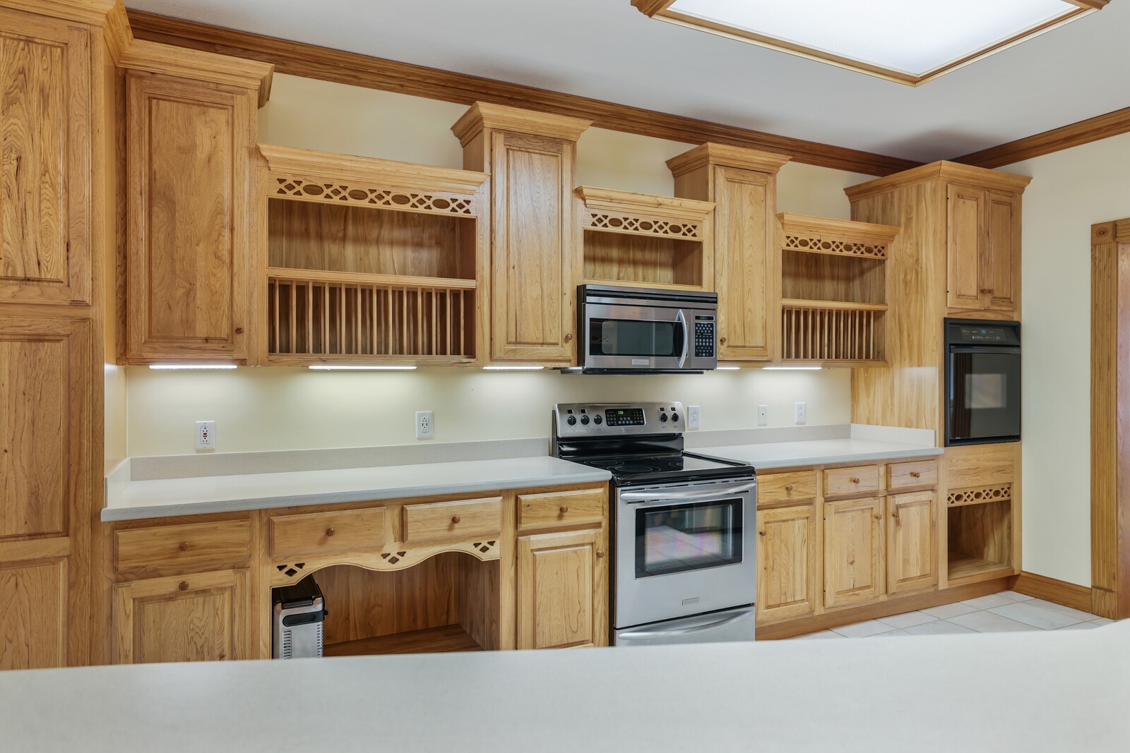 647 Mobley Road Clarksville, TN 37043 - Photo 16 of 69 a kitchen with stainless steel appliances granite countertop a stove and a microwave