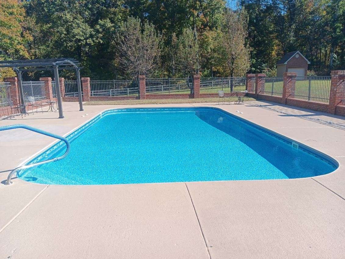 647 Mobley Road Clarksville, TN 37043 - Photo 2 of 69 a swimming pool with outdoor seating and yard