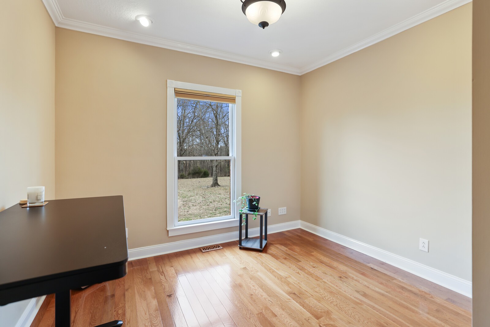 647 Mobley Road Clarksville, TN 37043 - Photo 27 of 69 an empty room with wooden floor and windows