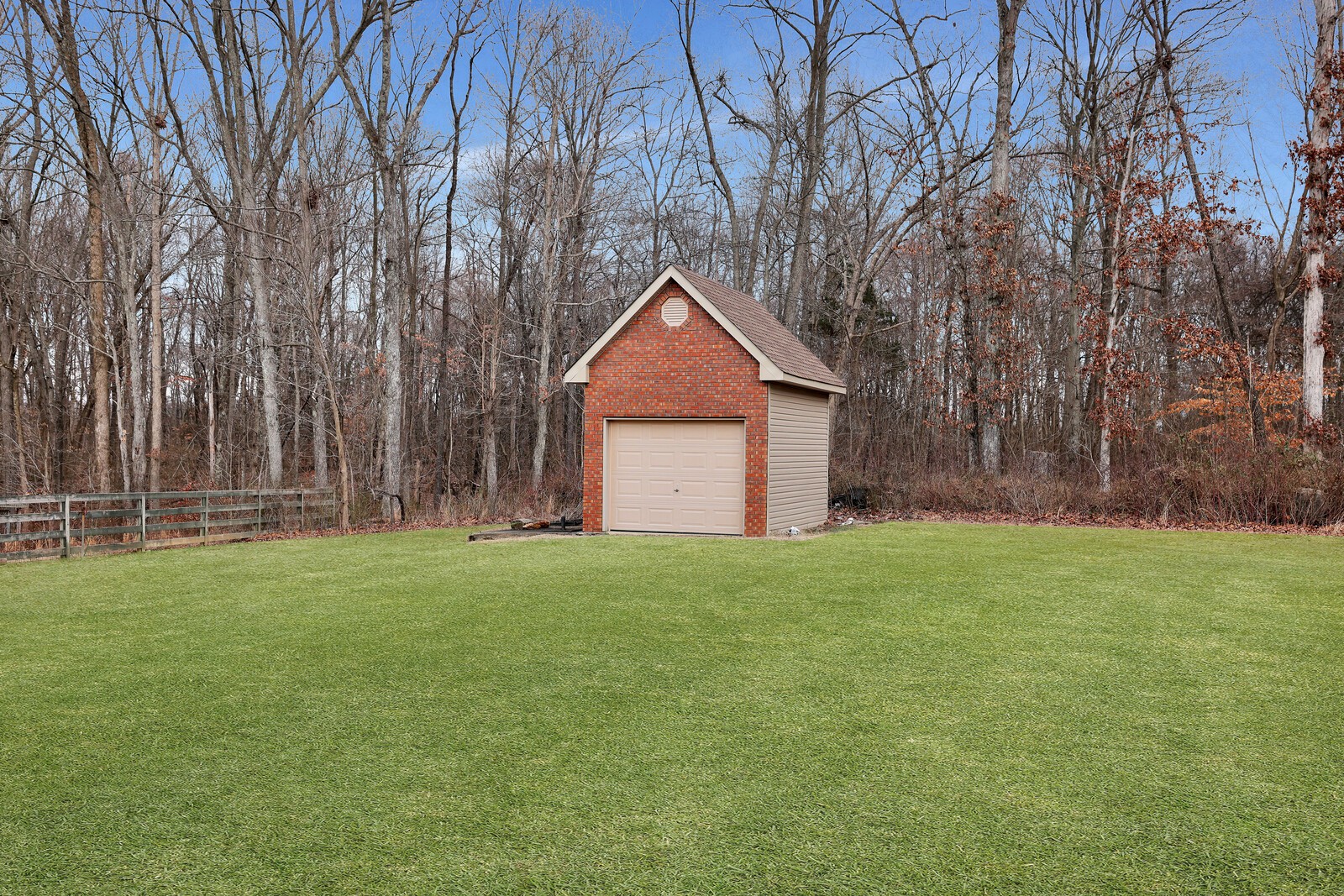 647 Mobley Road Clarksville, TN 37043 - Photo 49 of 69 a backyard of a house with large trees and wooden fence