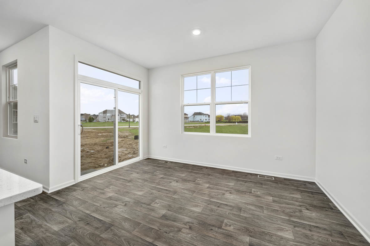 750 Kentshire Circle Elgin, IL 60124 - Photo 11 of 23 an empty room with wooden floor and windows