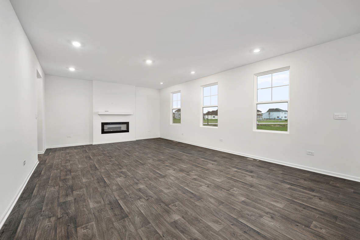 750 Kentshire Circle Elgin, IL 60124 - Photo 12 of 23 a view of empty room with wooden floor and windows