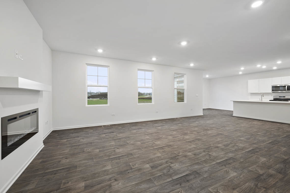 750 Kentshire Circle Elgin, IL 60124 - Photo 13 of 23 a view of an empty room with a window and fireplace