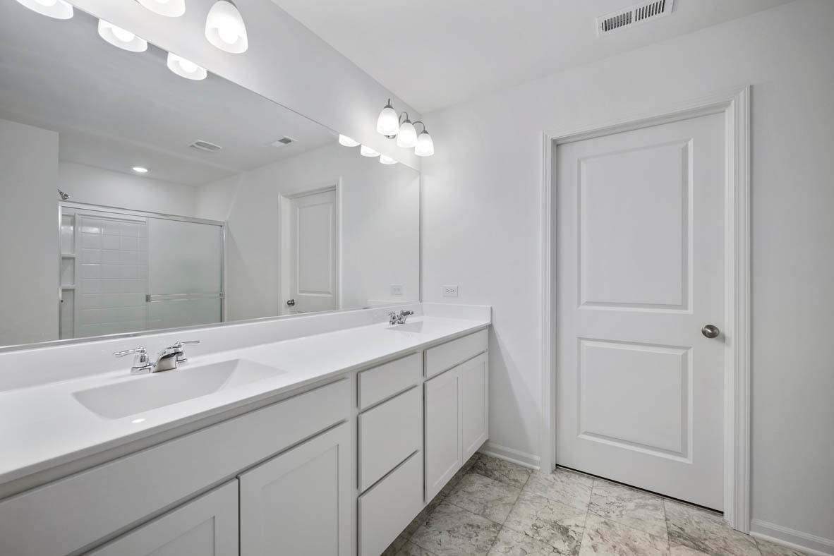750 Kentshire Circle Elgin, IL 60124 - Photo 21 of 23 a bathroom with a double vanity sink and a mirror