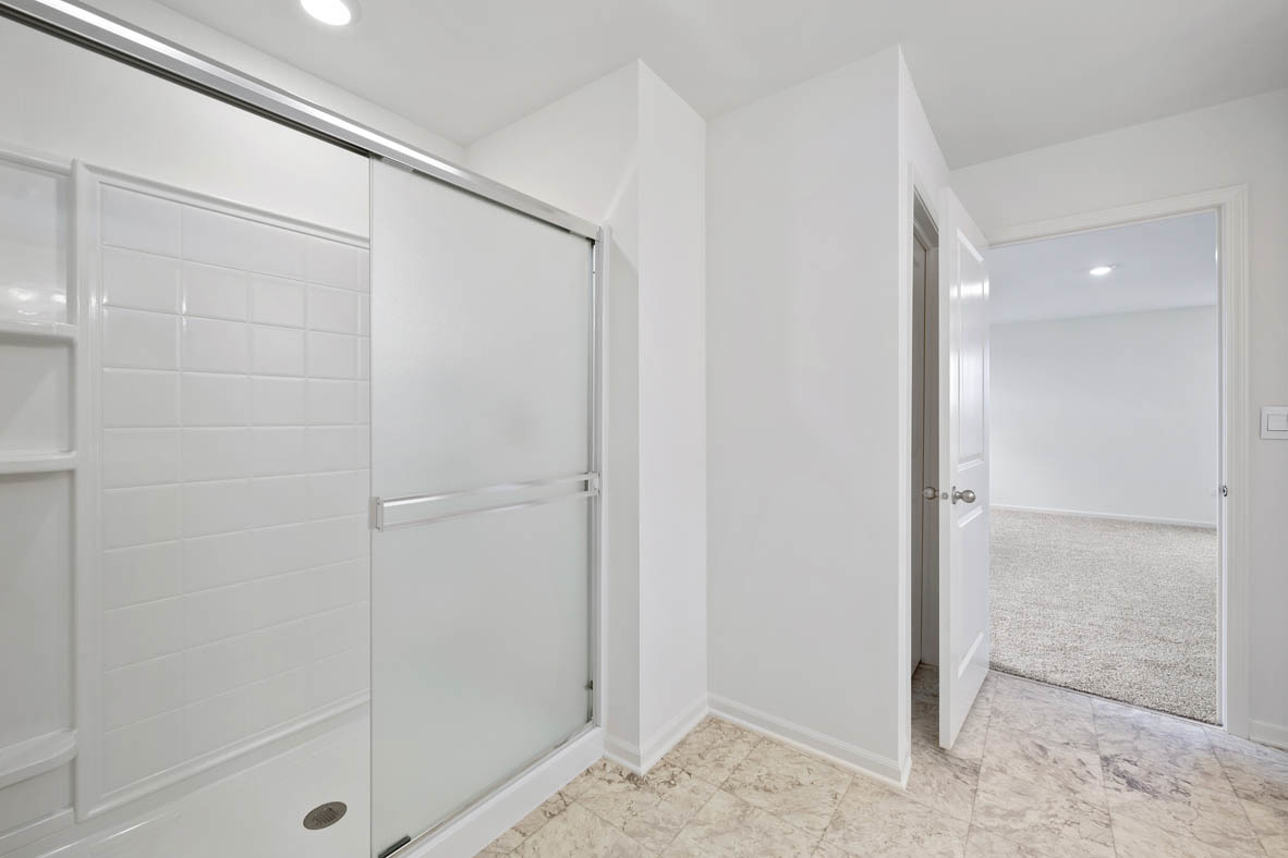750 Kentshire Circle Elgin, IL 60124 - Photo 22 of 23 a bathroom with a glass shower door