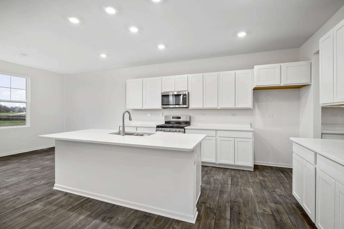 750 Kentshire Circle Elgin, IL 60124 - Photo 6 of 23 a kitchen with kitchen island a sink stainless steel appliances and cabinets