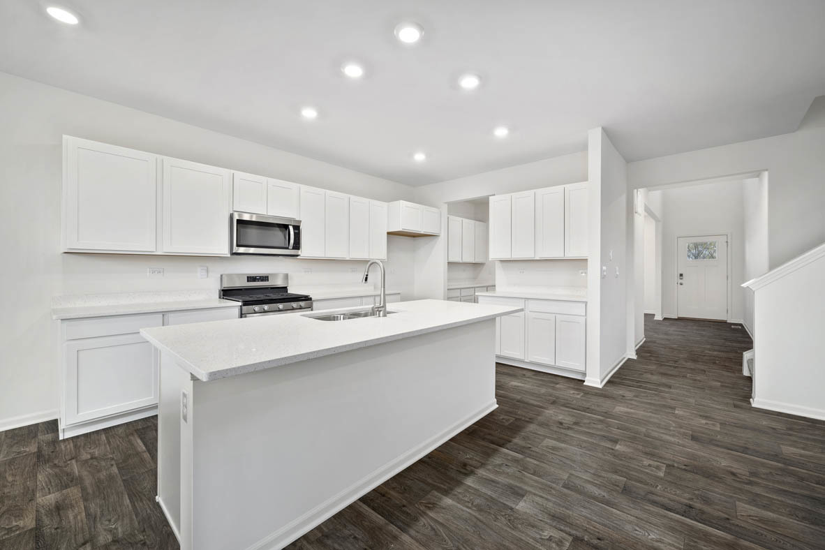 750 Kentshire Circle Elgin, IL 60124 - Photo 8 of 23 a kitchen with white cabinets and stainless steel appliances