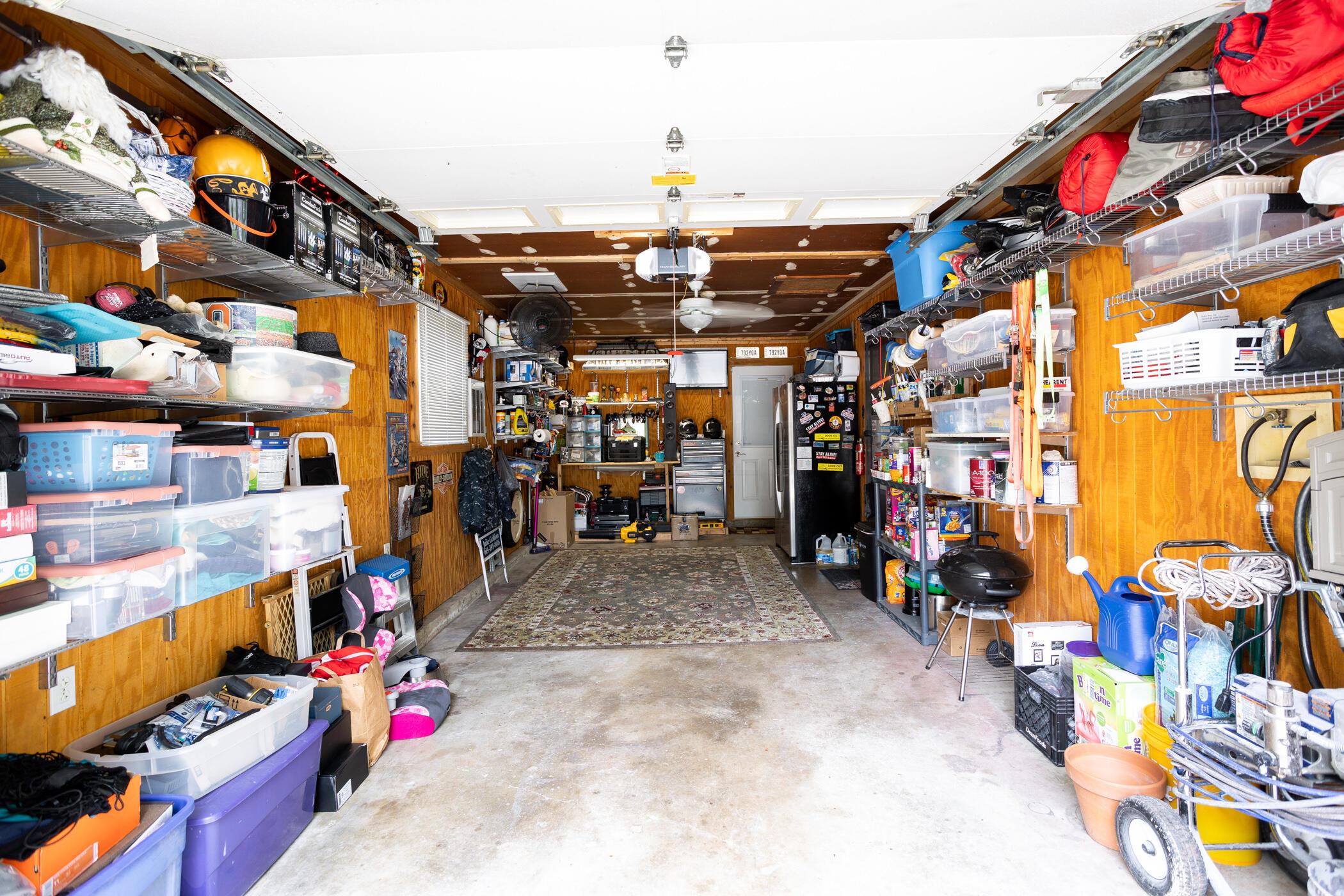 6330 Faircrest Road Columbus, OH 43229 - Photo 34 of 52 Attached heated, insulated, cedar garage with shelving.