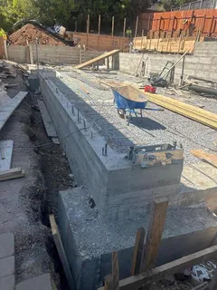 a view of wooden house with outdoor seating