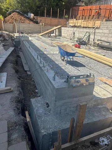 a view of wooden house with outdoor seating