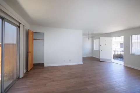 a kitchen with a sink a stove and cabinets