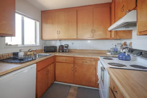 a bedroom with a bed and a tv