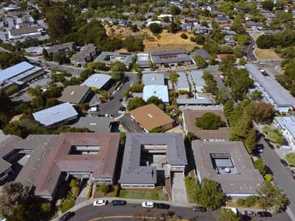 an aerial view of a city with lots of residential buildings