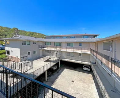 a view of balcony with furniture