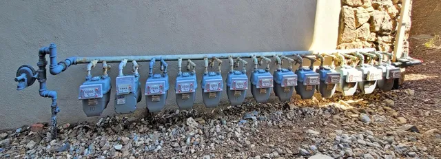 a kitchen with a stove and a wooden floor