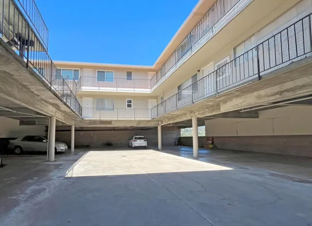a view of an chairs and tables in the balcony