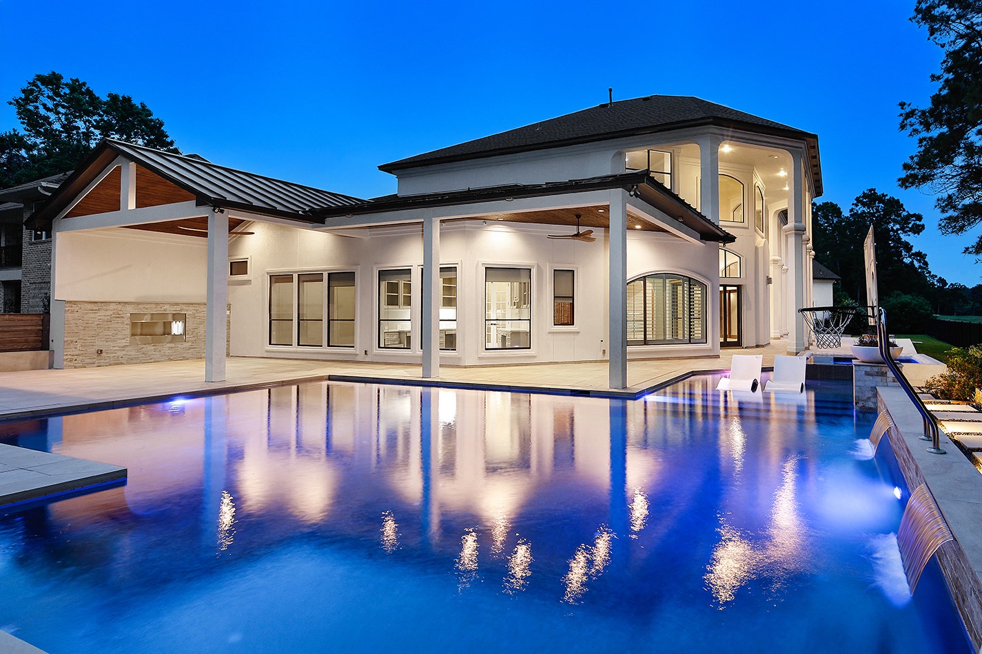 70 Quail Rock Place The Woodlands, TX 77381 - Photo 2 of 46 a view of a house with a swimming pool