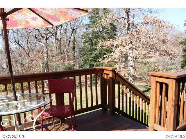 3008 Osborne Road Chester, VA 23831 - Photo 5 of 12 a view of a balcony with wooden floor and fence
