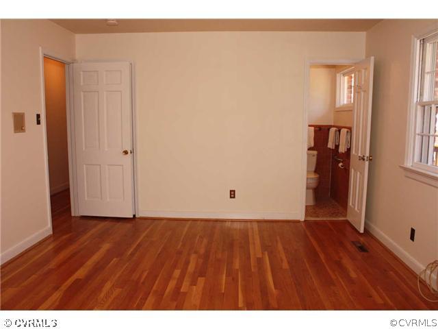 3008 Osborne Road Chester, VA 23831 - Photo 6 of 12 a view of an empty room with wooden floor and closet