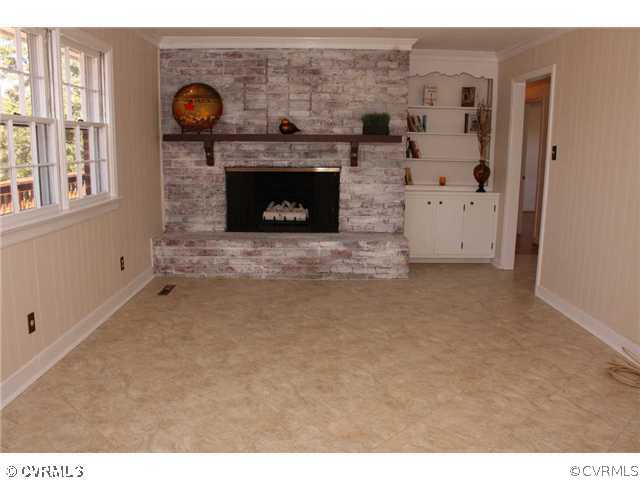 3008 Osborne Road Chester, VA 23831 - Photo 8 of 12 a view of a livingroom with a fireplace